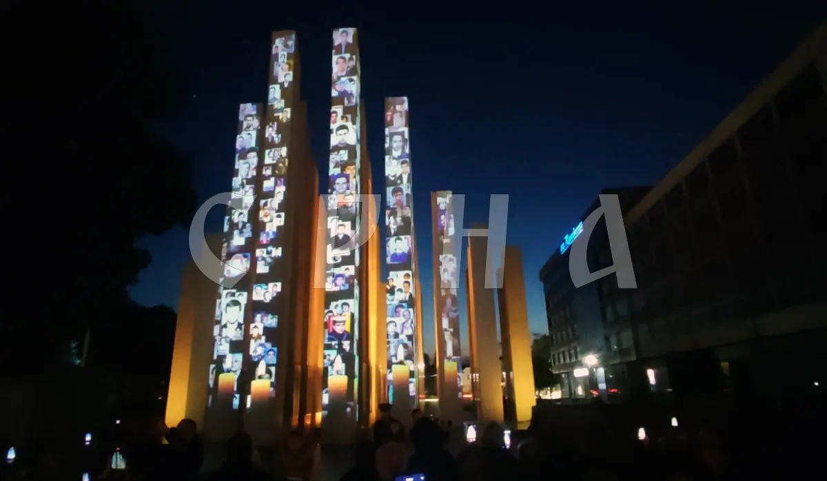 PORTRAITS OF FALLEN SOLDIERS AND FAMILY TESTIMONIES DISPLAYED ON THE CENTRAL MEMORIAL
