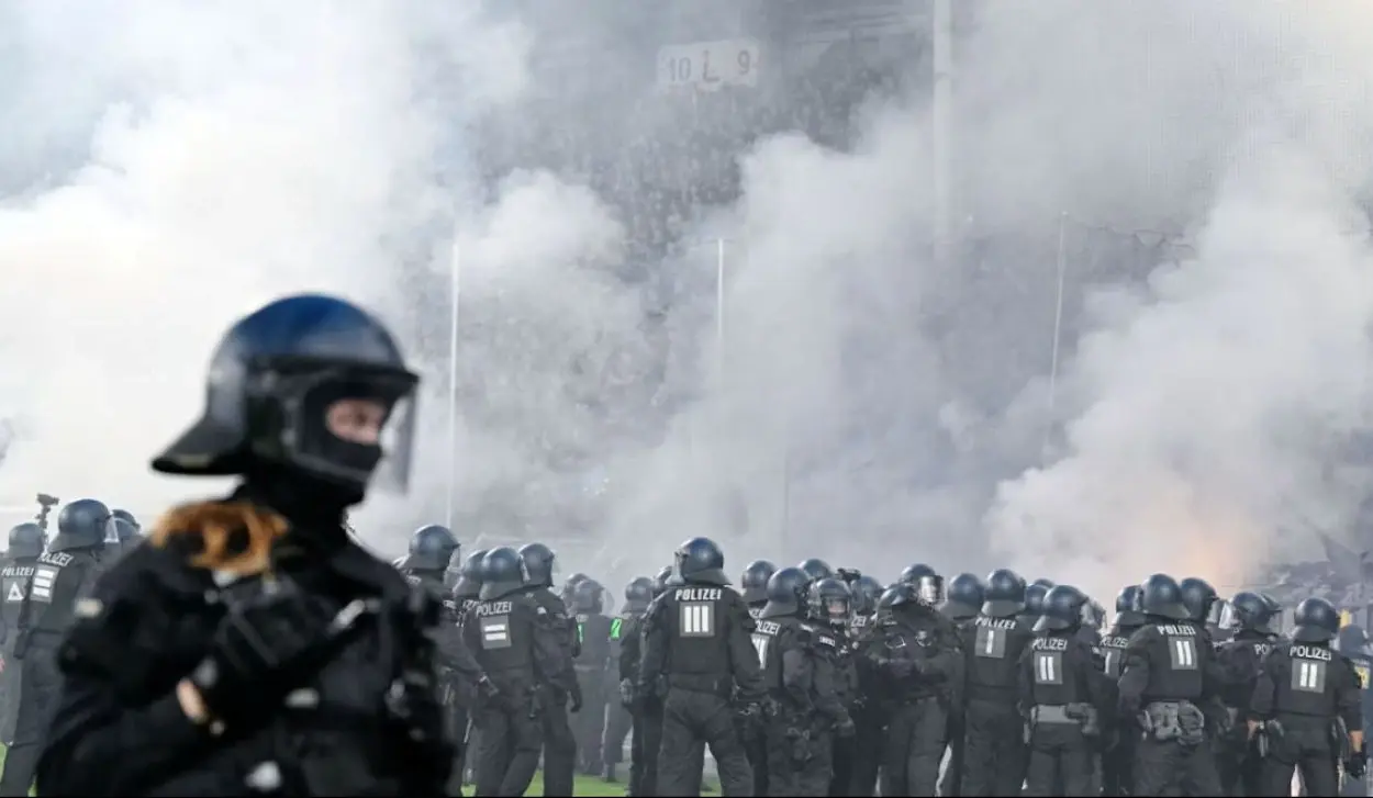 35 POLICE INJURED AS VIOLENCE ERUPTS AT CUP MATCH