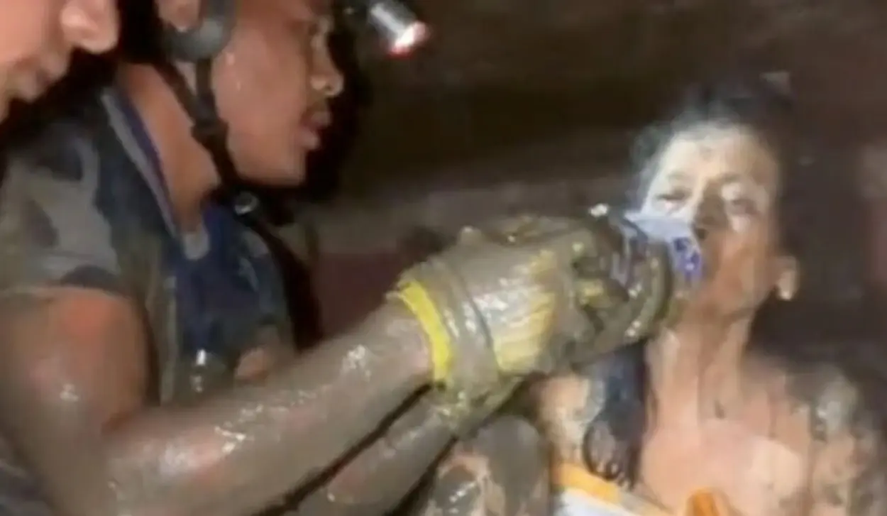 WOMAN PULLED ALIVE FROM RUINS 11 DAYS AFTER FLOODS