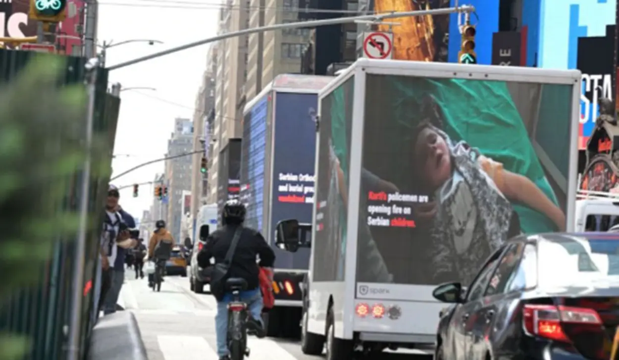 TRUCKS CARRYING VIDEO BILLBOARDS DRIVE THROUGH NEW YORK SHOWING LIVES OF SERBS IN KOSOVO AND METOHIJA