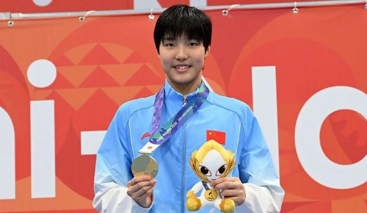 SWIMMING SENSATION 13-YEAR-OLD YU ZIDI WINS GOLD IN 200M