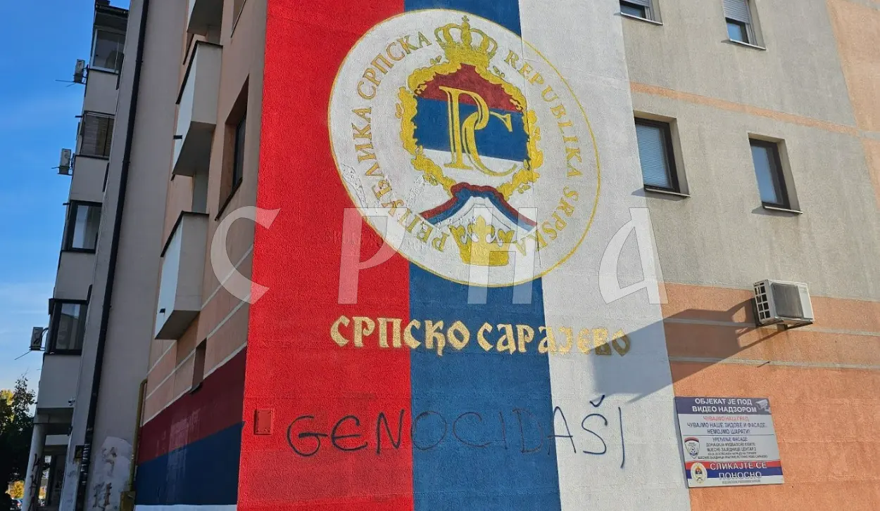 OFFENSIVE INSCRIPTION "GENOCIDAL" PAINTED ON SERB TRICOLOUR MURAL