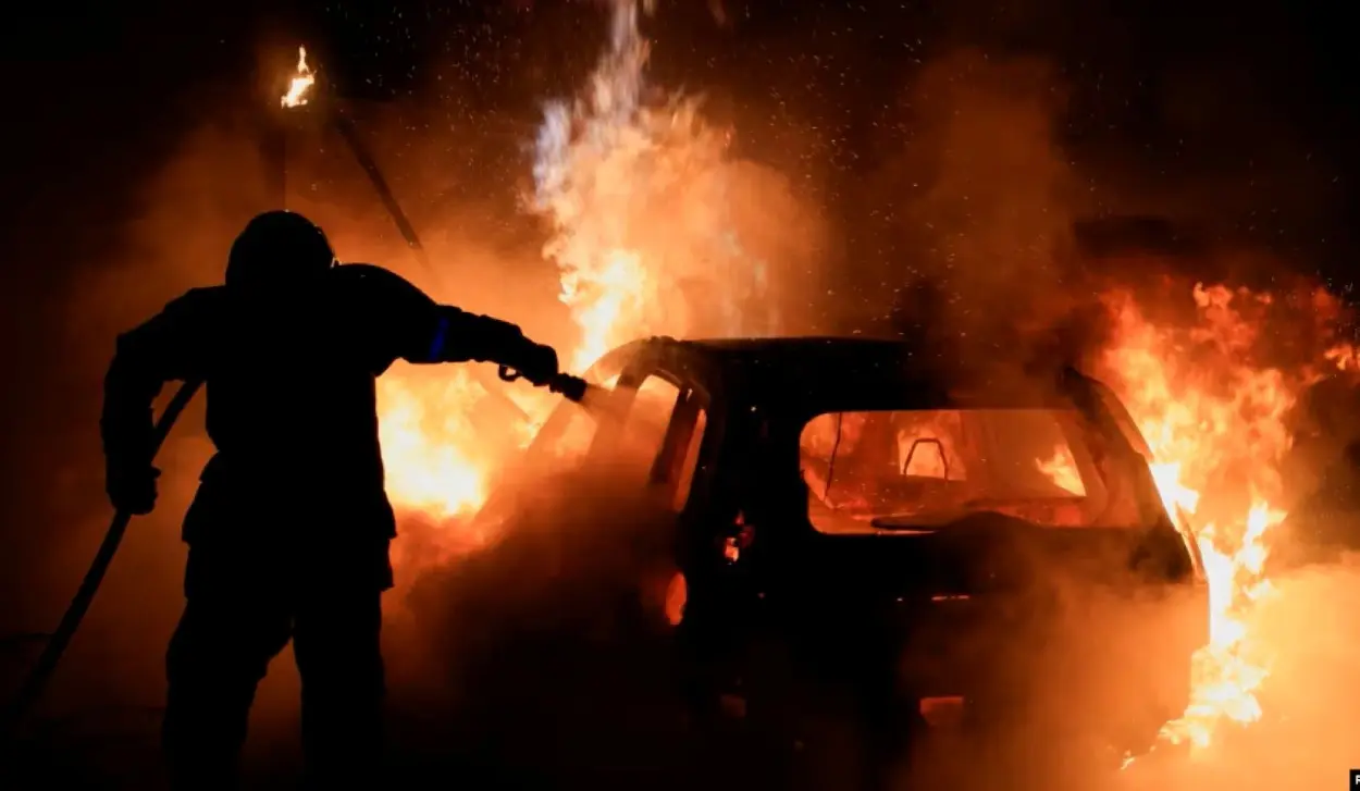 NEWSSTAND AND CAR SET ON FIRE IN PARIS