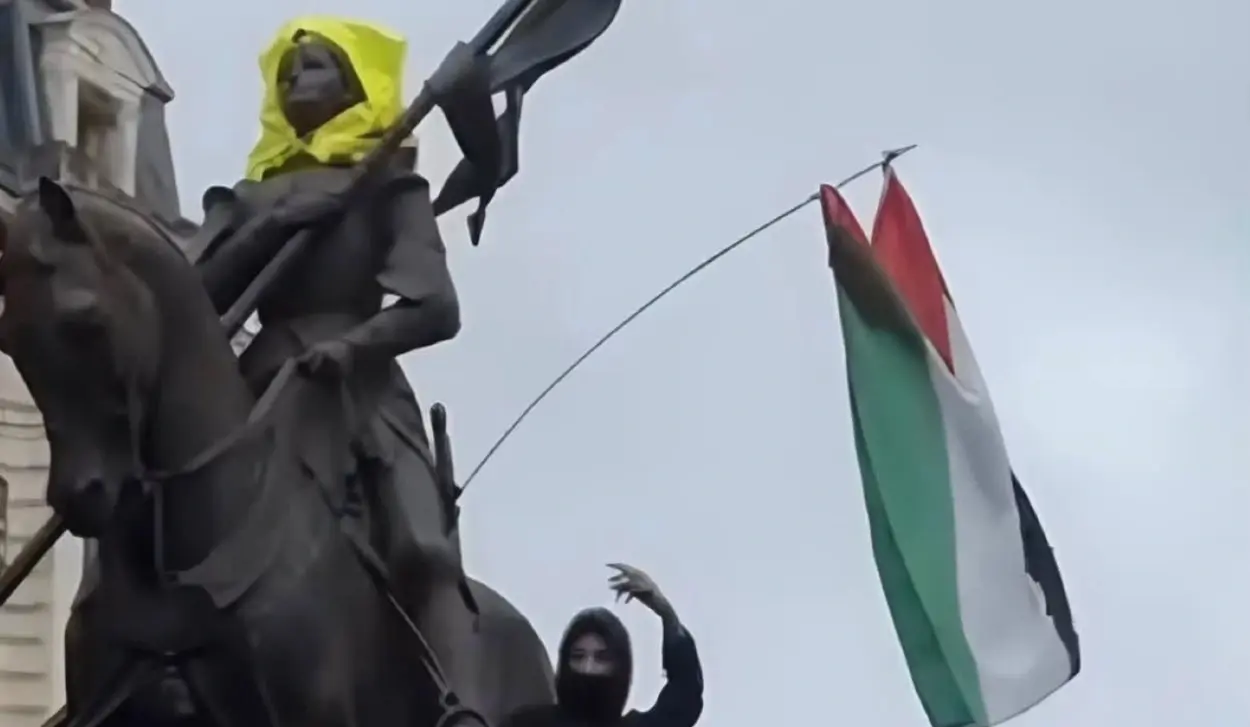 PROTESTERS PLACE HIJAB ON STATUE OF JOAN OF ARC