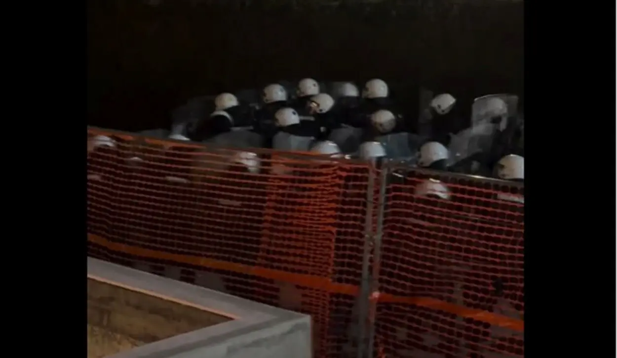 CLASHES WITH POLICE OUTSIDE INFORMER BUILDING