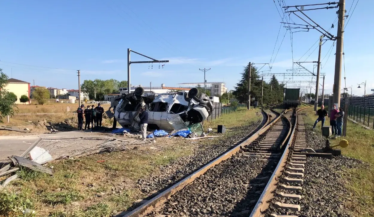SIX PEOPLE KILLED IN TRAIN-MINIBUS COLLISION
